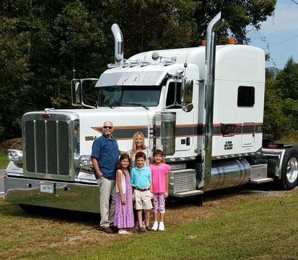 Roane Transportation driver Terry Hodges with his family in front of his truck