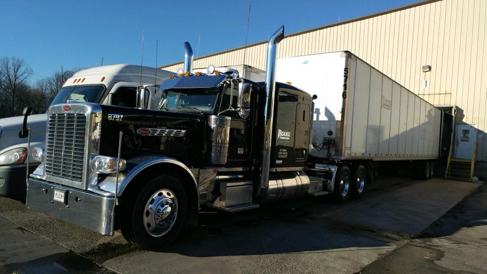 roane transportation truck pulled up to a loading dock waiting on it's LTL shipping