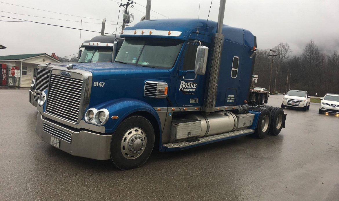 Roane Transportation semi truck sitting in the yard.