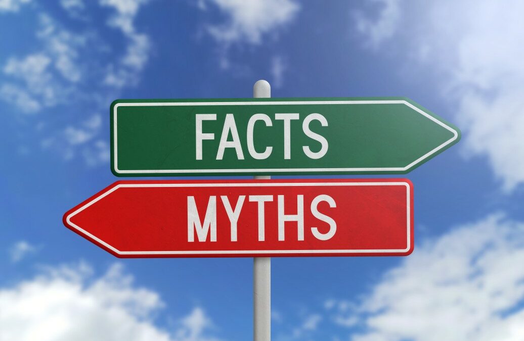 green sign with word "facts" over a red sign that says "myths" on a blue sky background
